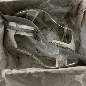 Never worn Bandolino open toed heels.